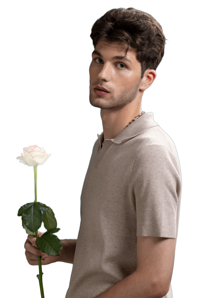 a sugar boy in a polo shirt holding a rose